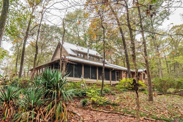 rear view of house with a sunroom