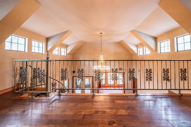 interior space with a chandelier, french doors, dark hardwood / wood-style flooring, and plenty of natural light