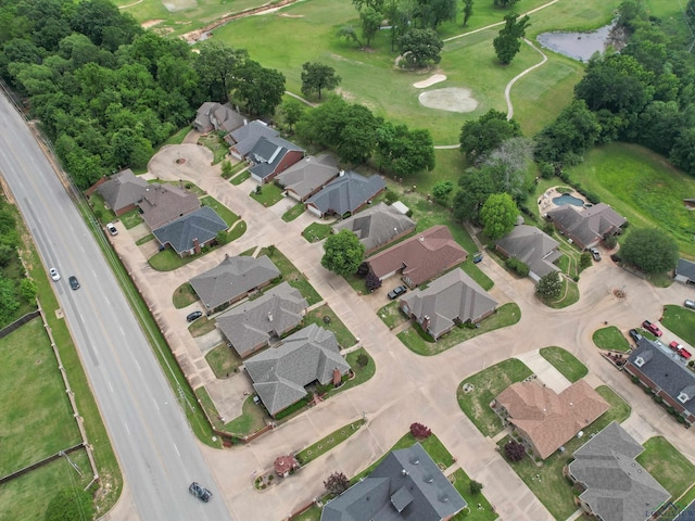 drone / aerial view featuring a water view and a residential view