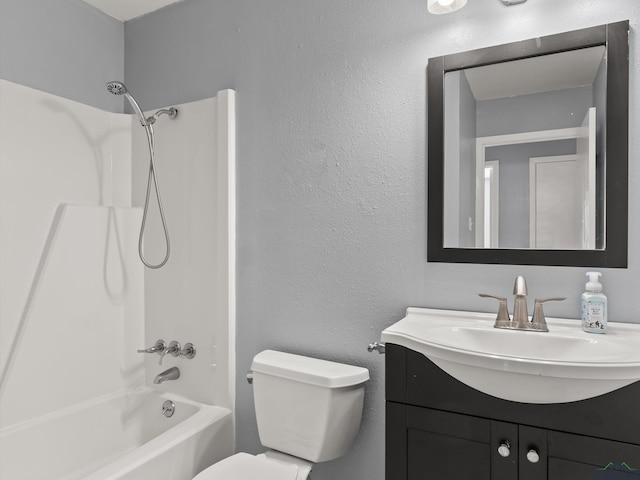 full bathroom featuring toilet, vanity, and tub / shower combination