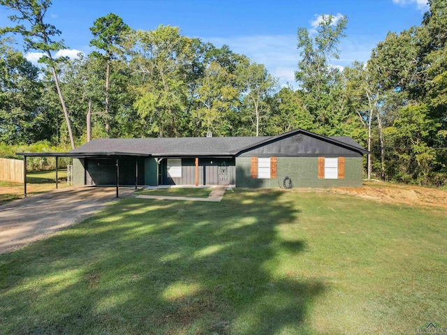 single story home featuring a front lawn and a carport