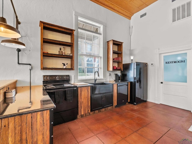 kitchen with wood ceiling, vaulted ceiling, sink, black appliances, and hanging light fixtures