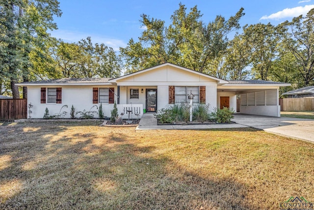 ranch-style house featuring a carport, a porch, and a front lawn