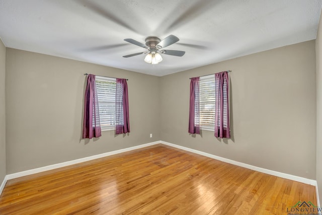 unfurnished room featuring ceiling fan and light hardwood / wood-style flooring