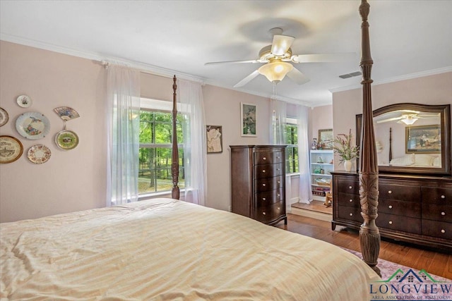 bedroom featuring ornamental molding, wood finished floors, and ceiling fan