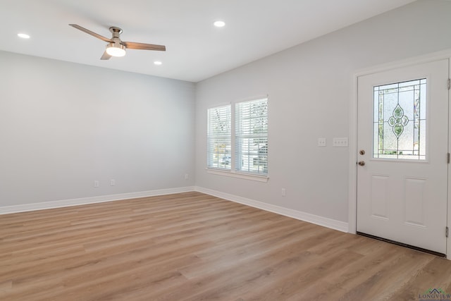 entryway with ceiling fan and light hardwood / wood-style floors