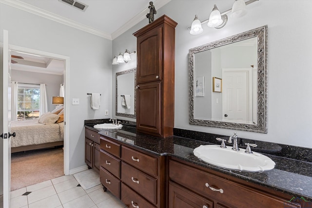 bathroom with tile patterned flooring, vanity, and ornamental molding