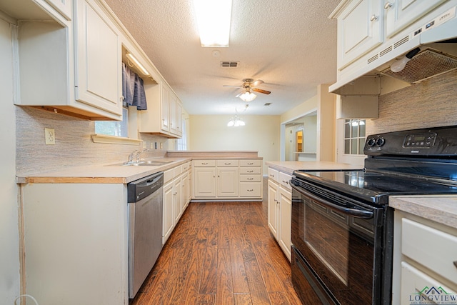 kitchen featuring dark hardwood / wood-style flooring, stainless steel dishwasher, a textured ceiling, electric range, and white cabinets