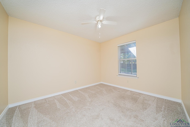 empty room with light carpet, a textured ceiling, and ceiling fan