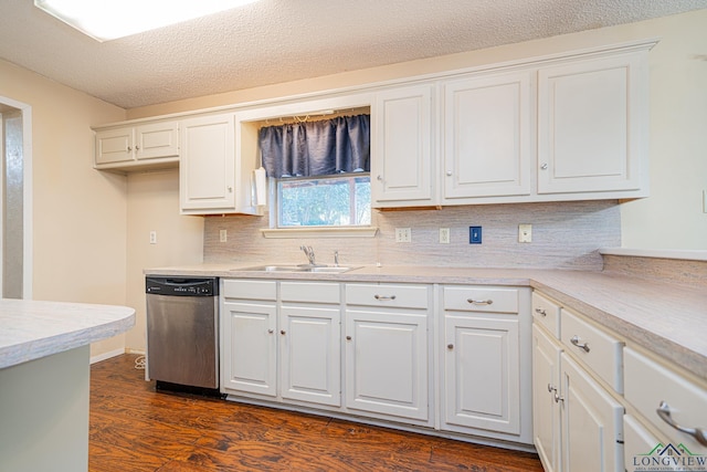 kitchen featuring white cabinetry, dishwasher, sink, dark wood-type flooring, and a textured ceiling