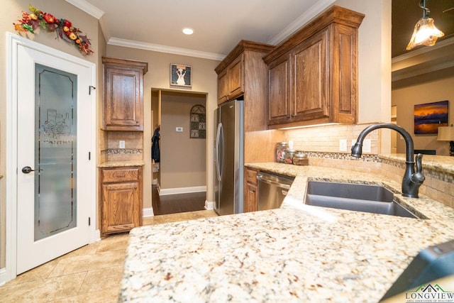 2106 Katie Lee Ln, Longview, TX 75601 - kitchen with a sink, appliances with stainless steel finishes, light stone countertops, backsplash, and crown molding