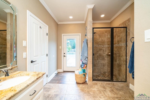 2106 Katie Lee Ln, Longview, TX 75601 - bathroom with vanity, a stall shower, crown molding, baseboards, and recessed lighting