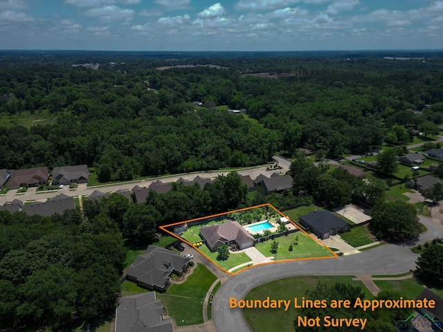 2106 Katie Lee Ln, Longview, TX 75601 - aerial view of residential area with a forest, property boundaries highlighted, and a pool area