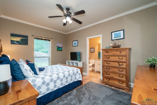 2106 Katie Lee Ln, Longview, TX 75601 - bedroom with crown molding, light wood-style flooring, baseboards, a ceiling fan, and ensuite bath