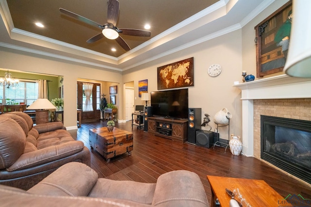 2106 Katie Lee Ln, Longview, TX 75601 - living room with a raised ceiling, ornamental molding, hardwood / wood-style flooring, a ceiling fan, and a fireplace
