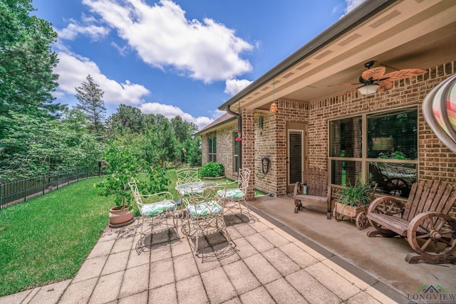 2106 Katie Lee Ln, Longview, TX 75601 - view of patio with ceiling fan and outdoor dining space