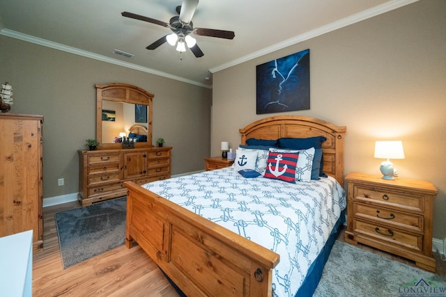 2106 Katie Lee Ln, Longview, TX 75601 - bedroom with crown molding, light wood-style flooring, ceiling fan, and baseboards