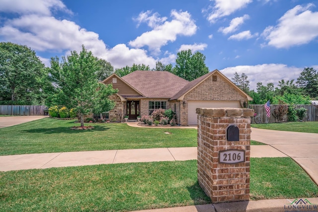 2106 Katie Lee Ln, Longview, TX 75601 - view of front of property with brick siding, a garage, and concrete driveway