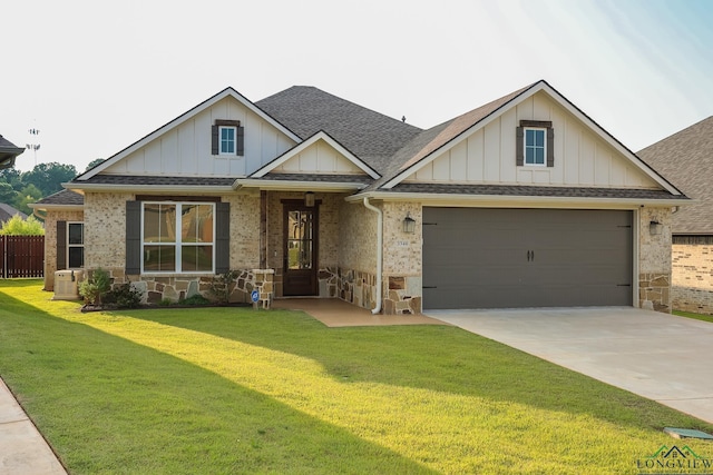 craftsman inspired home with a garage and a front yard