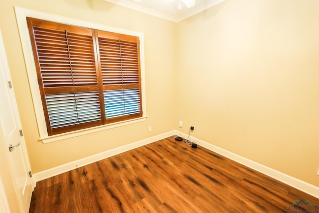 empty room with crown molding and hardwood / wood-style flooring