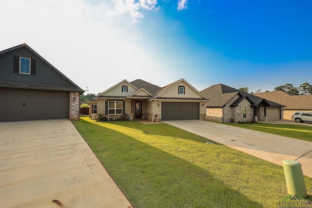 craftsman-style home with a garage and a front lawn