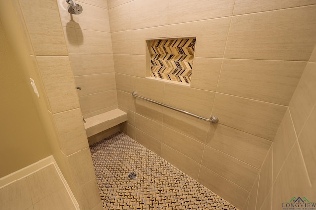 bathroom featuring tiled shower