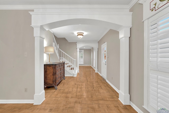 corridor featuring decorative columns, ornamental molding, and light parquet flooring