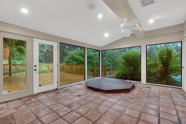 unfurnished sunroom with vaulted ceiling with beams, plenty of natural light, and ceiling fan