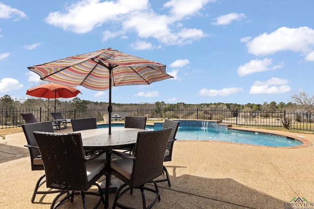 view of swimming pool featuring a fenced in pool, fence, and a patio area