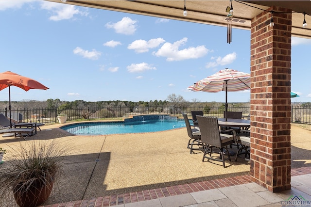 view of swimming pool featuring a patio area, a fenced in pool, and fence