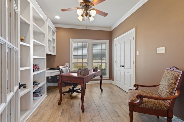 office area with crown molding, a ceiling fan, baseboards, and light wood finished floors