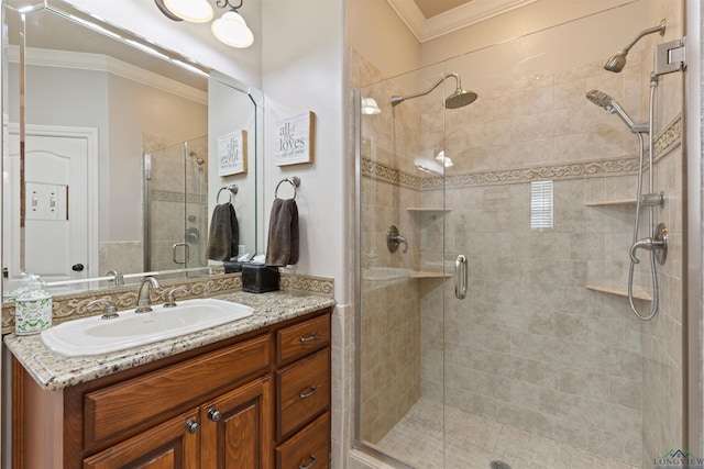 full bathroom with a stall shower, vanity, and ornamental molding