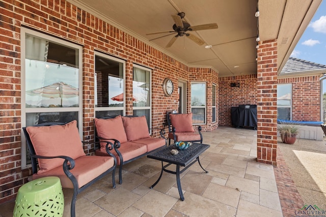 view of patio / terrace featuring an outdoor living space, area for grilling, and ceiling fan