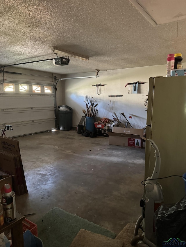 garage with white fridge and a garage door opener