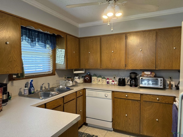 kitchen with dishwasher, crown molding, sink, ceiling fan, and a textured ceiling