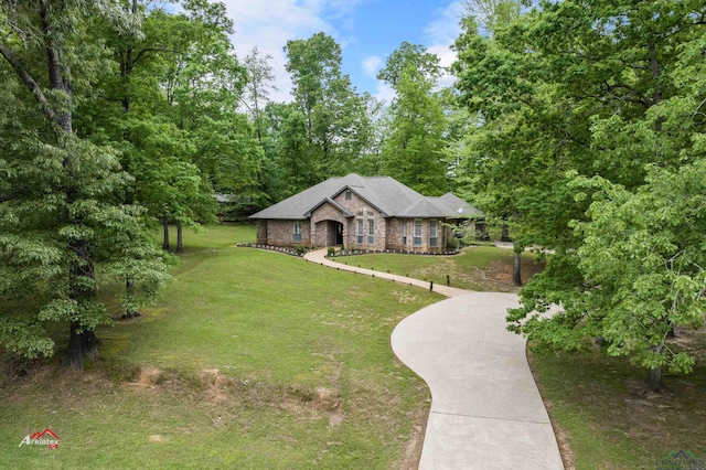 single story home featuring a front yard