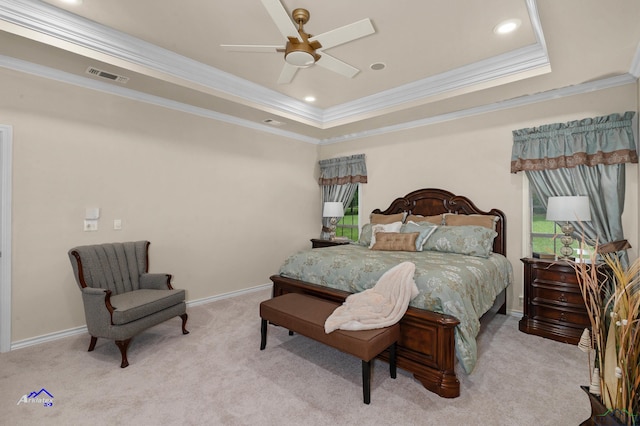 carpeted bedroom featuring a raised ceiling, ceiling fan, and crown molding