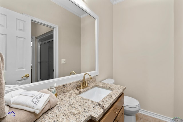 bathroom featuring tile patterned floors, crown molding, an enclosed shower, toilet, and vanity