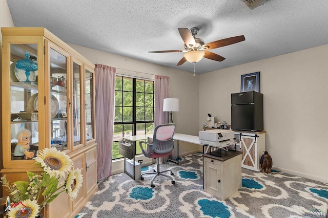 905 Moonbeam Ave, Center, TX 75935 - home office with a ceiling fan, baseboards, a textured ceiling, and carpet floors