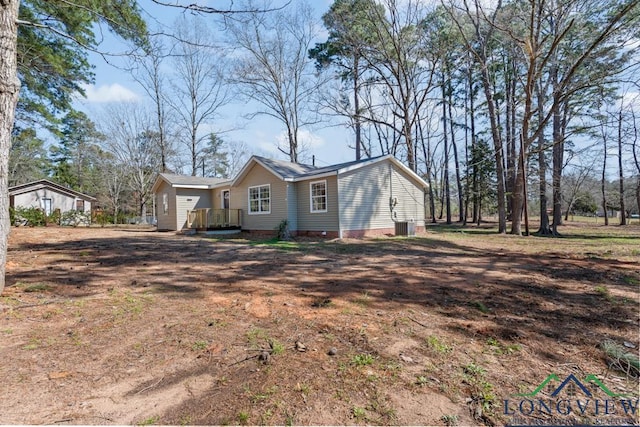 view of side of home featuring crawl space