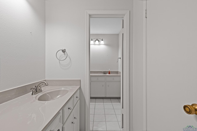 bathroom with tile patterned flooring and vanity