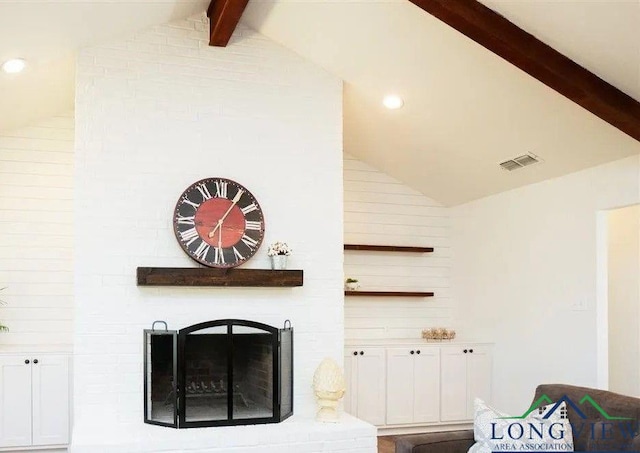 living area with visible vents, lofted ceiling with beams, a brick fireplace, and recessed lighting
