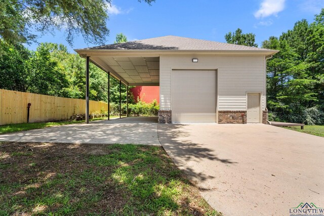 12265 Sable Ln, Whitehouse, TX 75791 - garage featuring concrete driveway and a garage