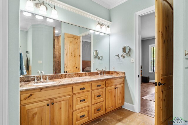 12265 Sable Ln, Whitehouse, TX 75791 - bathroom featuring crown molding, ensuite bathroom, double vanity, and baseboards