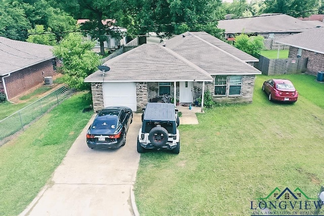 203 Reynolds St, Pittsburg, TX 75686 - ranch-style home featuring driveway, an attached garage, stone siding, and a fenced backyard