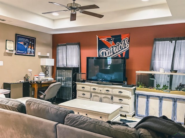 203 Reynolds St, Pittsburg, TX 75686 - living area featuring a raised ceiling and ceiling fan