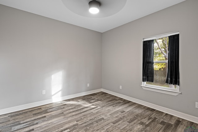 spare room featuring hardwood / wood-style flooring and ceiling fan