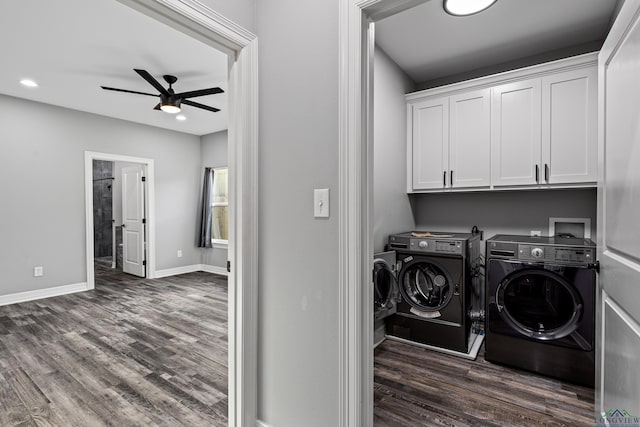 laundry room with ceiling fan, cabinets, dark hardwood / wood-style floors, and independent washer and dryer