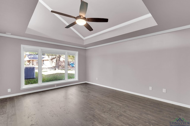 empty room featuring a tray ceiling, ceiling fan, and crown molding