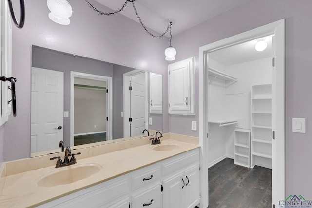 bathroom featuring hardwood / wood-style floors and vanity